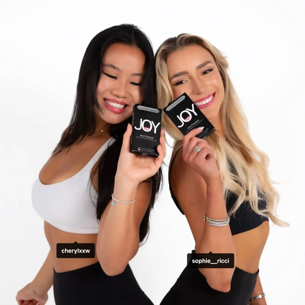 Joy Whitening creator proof image showing two influencers holding whitening products for a campaign collaboration.