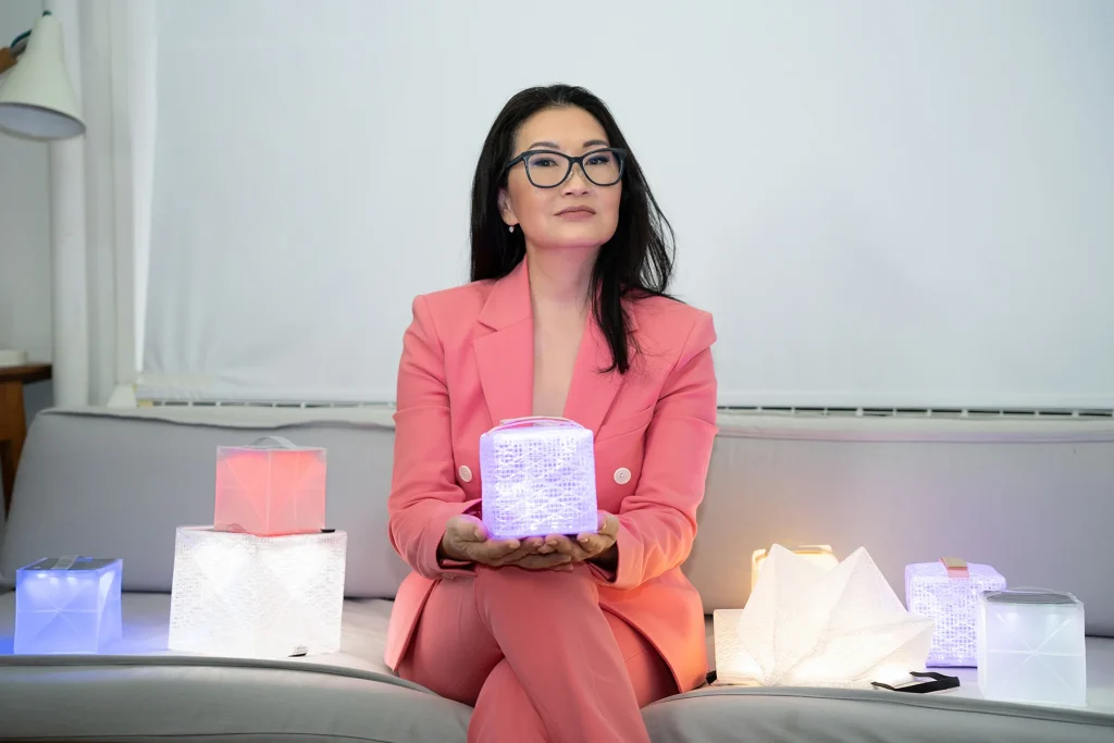 Solight Design founder Alice Chun holding a solar lantern for the Milo Agency public relations case study